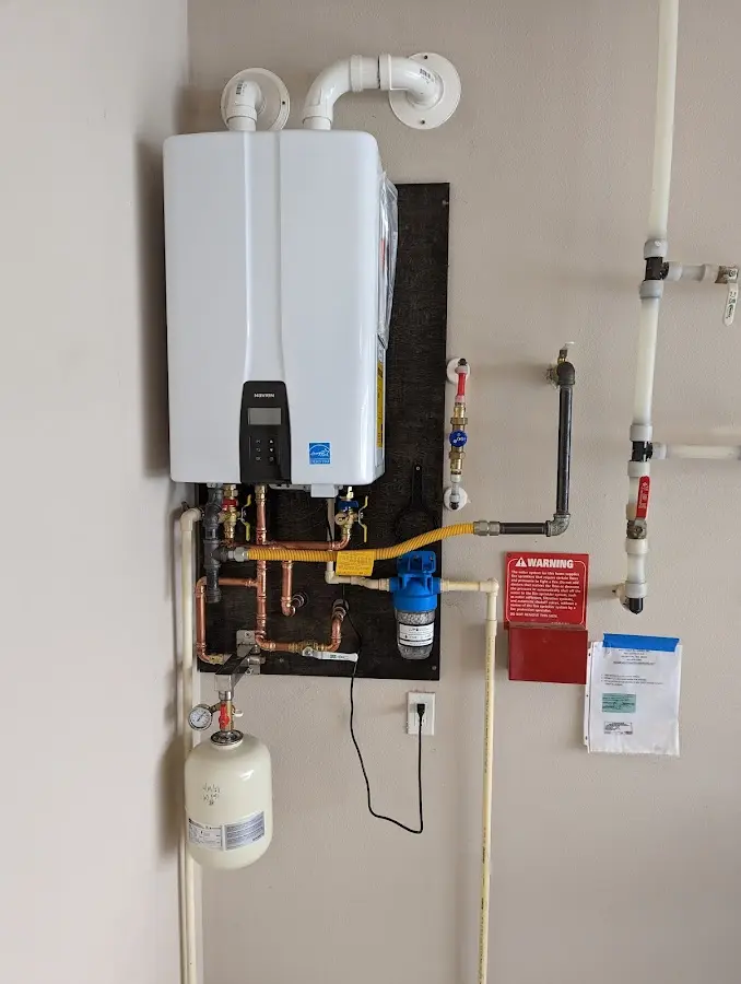 Professional plumber installing copper piping in a Calimesa home